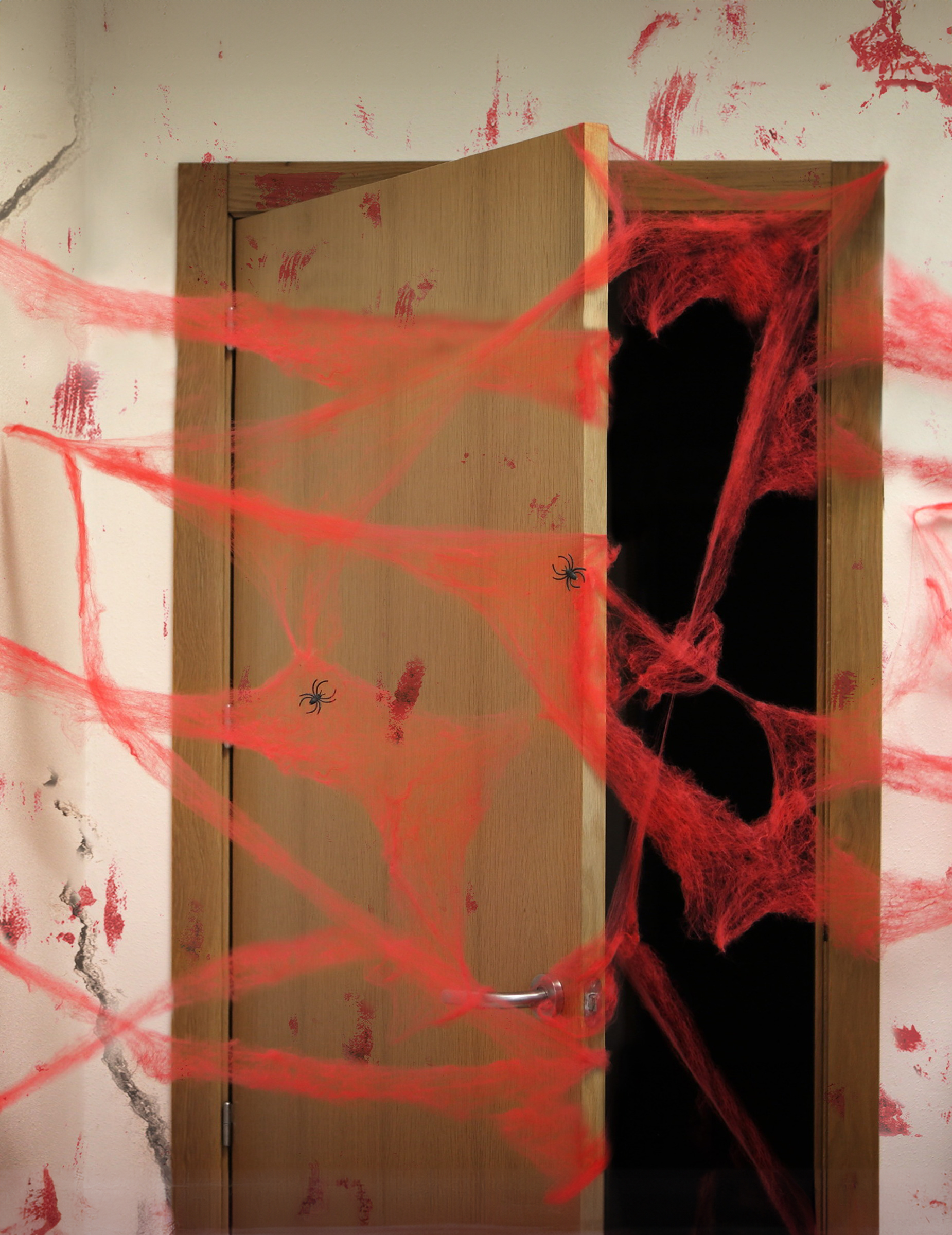 Décoration toile d'araigné rouge avec araignées 20 g Halloween